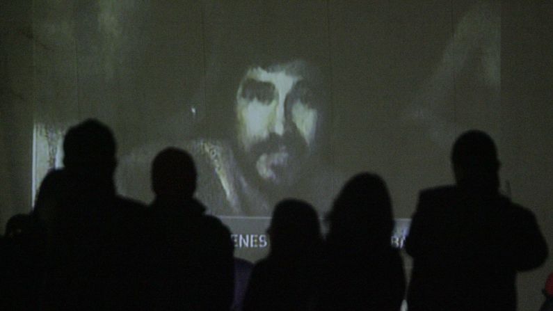 Relatives watch a video of the trapped miners on August 26. Chilean television aired footage of the miners, showing them in good spirits and explaining how their underground shelter was set up.